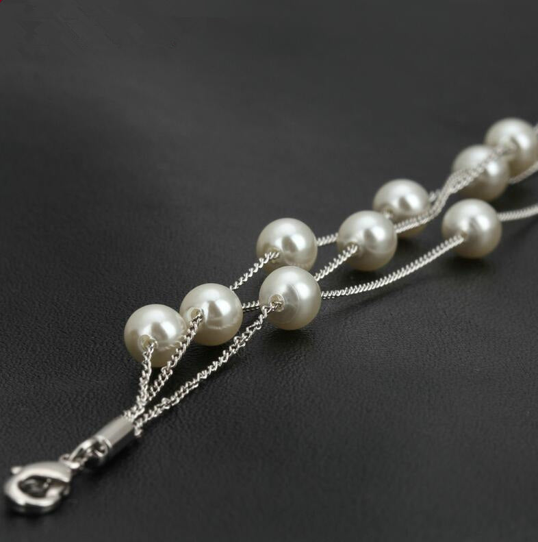 Unique Blend of Classic & Modern Three Layer Faux Pearl Bracelet.