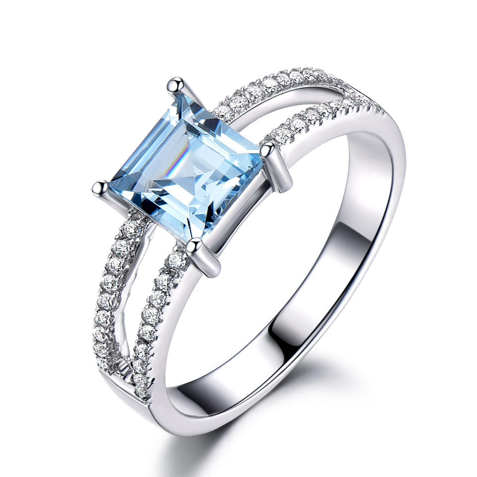 925 Sterling Silver Sky Blue Topaz Ring with Inlaid Gem Adornments.