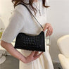 woman with a black fancy handbag