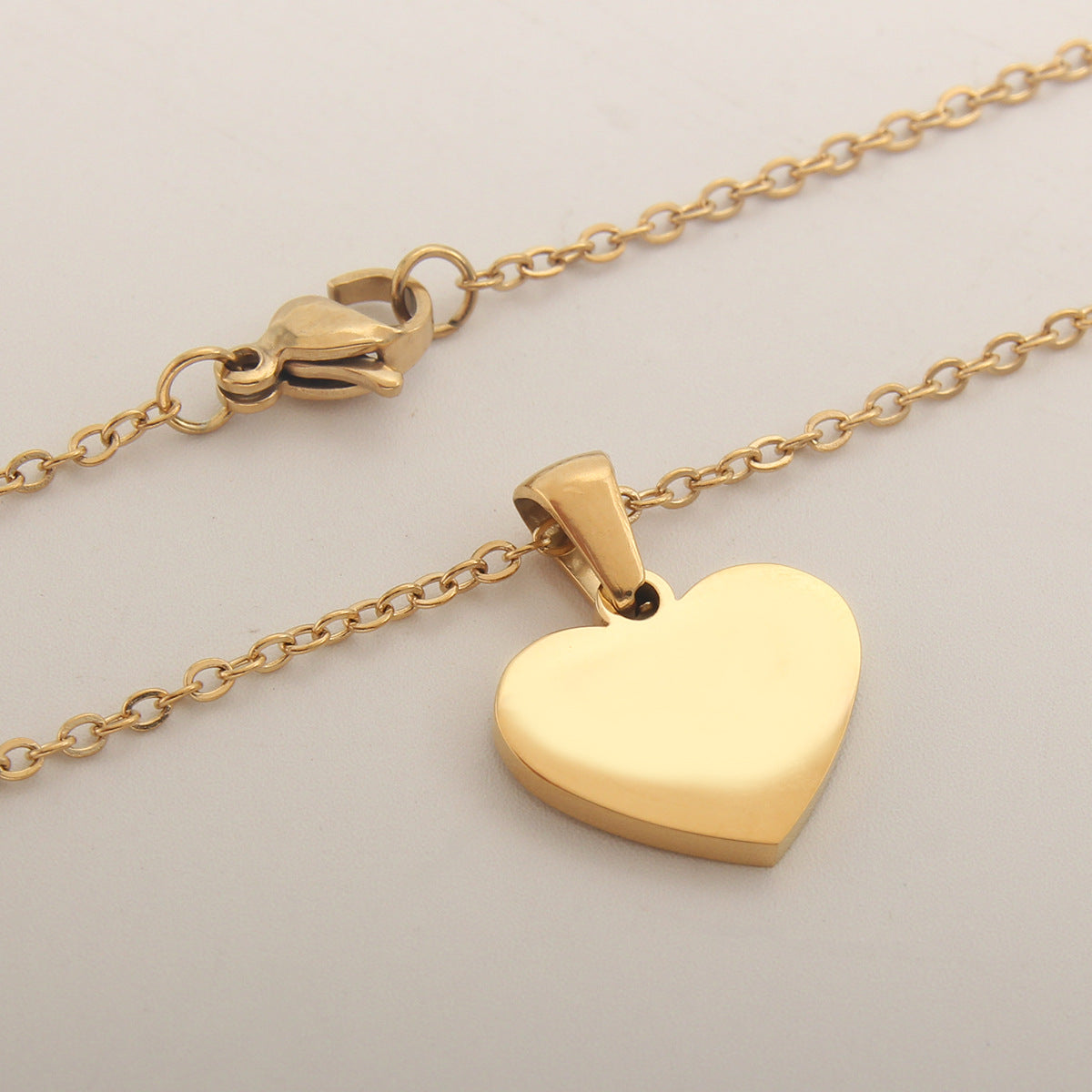 Sea Blue Mall Gold Plated Personalized Letter Heart-shaped Necklace with a White Shell  SeaBlueMall.com